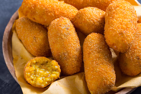 Traditional Roman supplì with gooey melted cheese