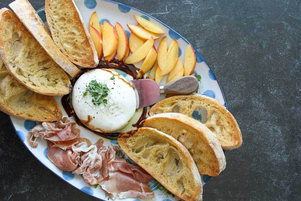 Italian antipasti burrata and prosciutto at Testaccio Market