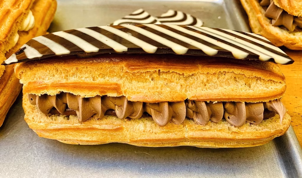 French éclairs filled with vanilla, lime, and chocolate cream